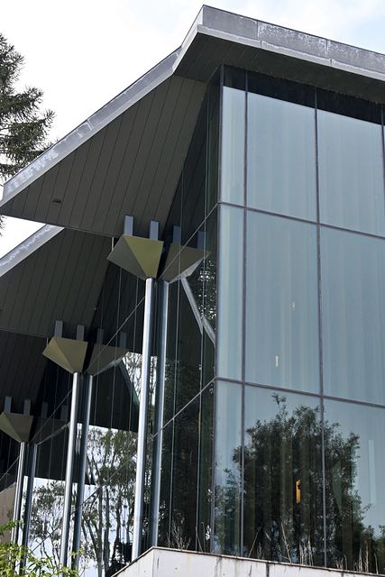 Angled roofline and glass wall of a building at UQ